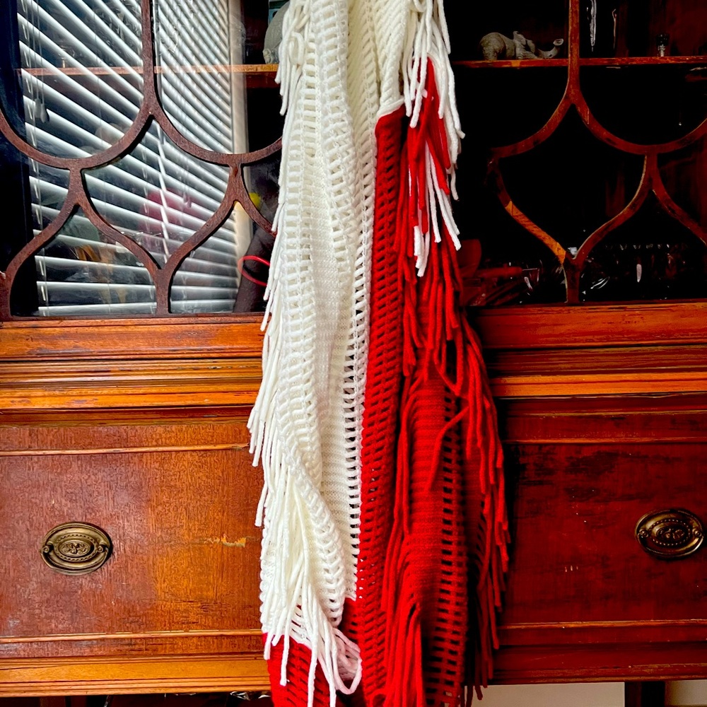 It’s a crimson and white scarf. Very warm. Great for foot ball games